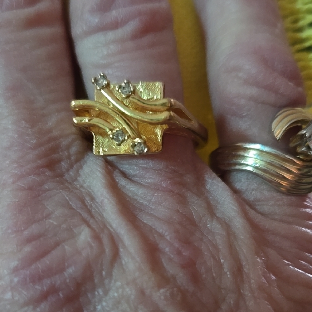 Elegant Gold Ring with Diamond Accents